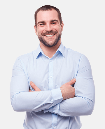 it is a profile photo as a man smiling wearing blue shirt standing as presenting himself to a camera 